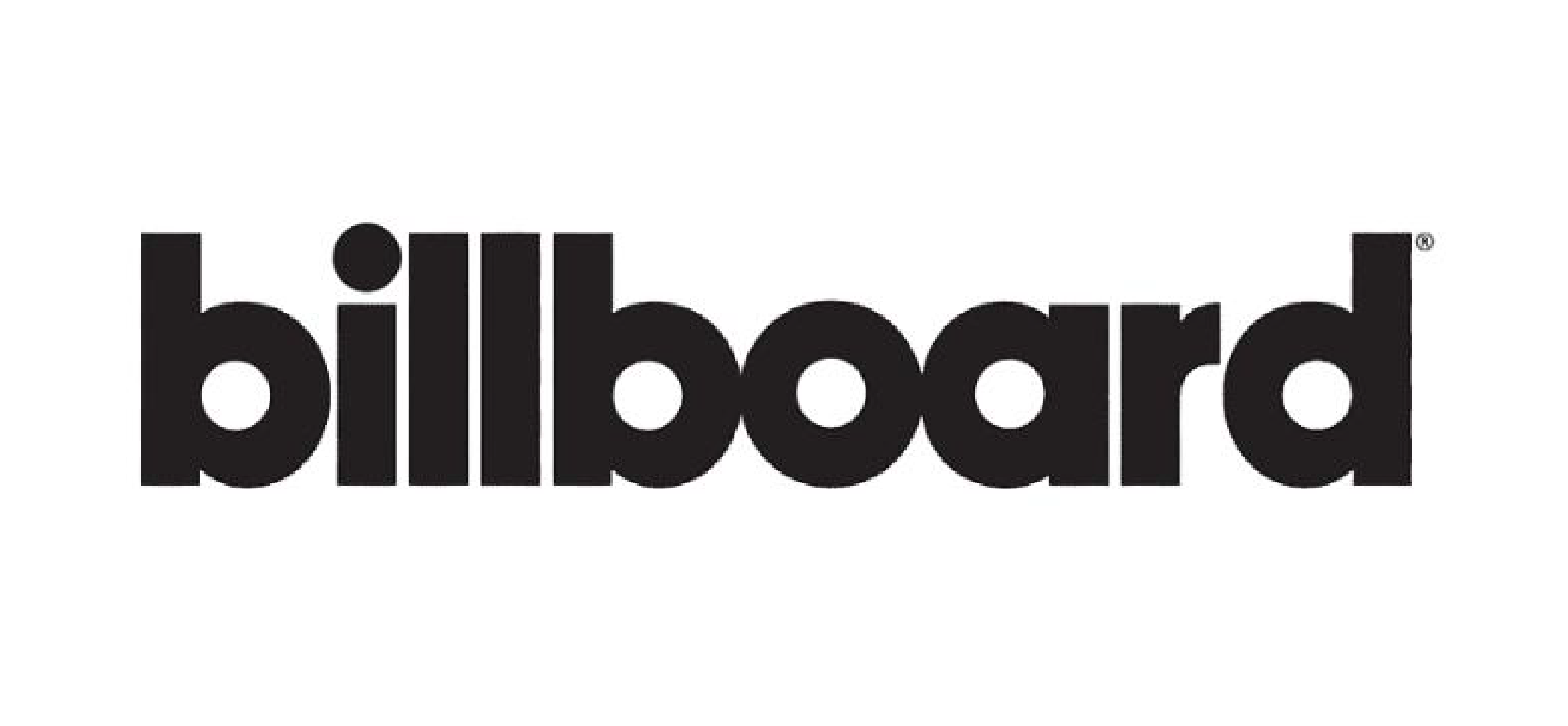 Black and white portrait of a dance instructor against a light background.