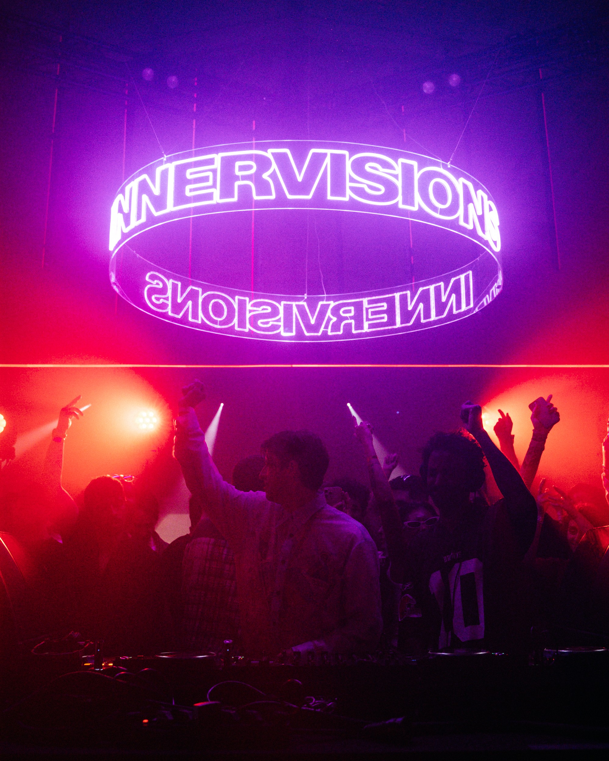 Black and white portrait of a dance instructor against a light background.